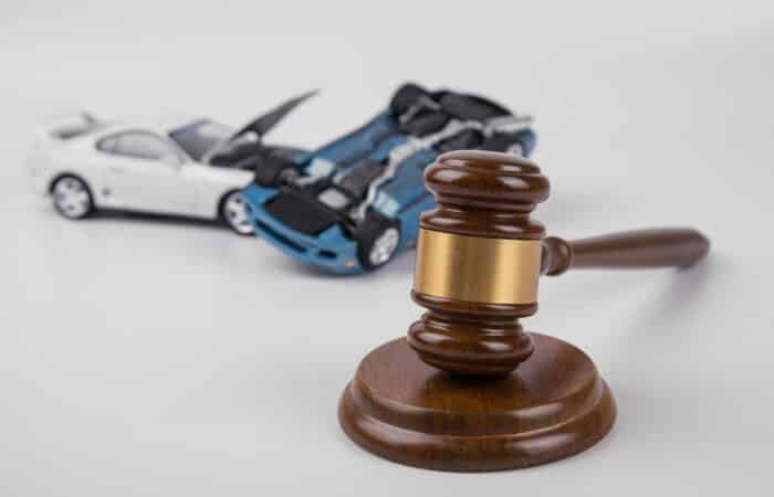 Hammer Of The Judge. Two Collided Cars On A White Background. Accident. Insurance, Court Case