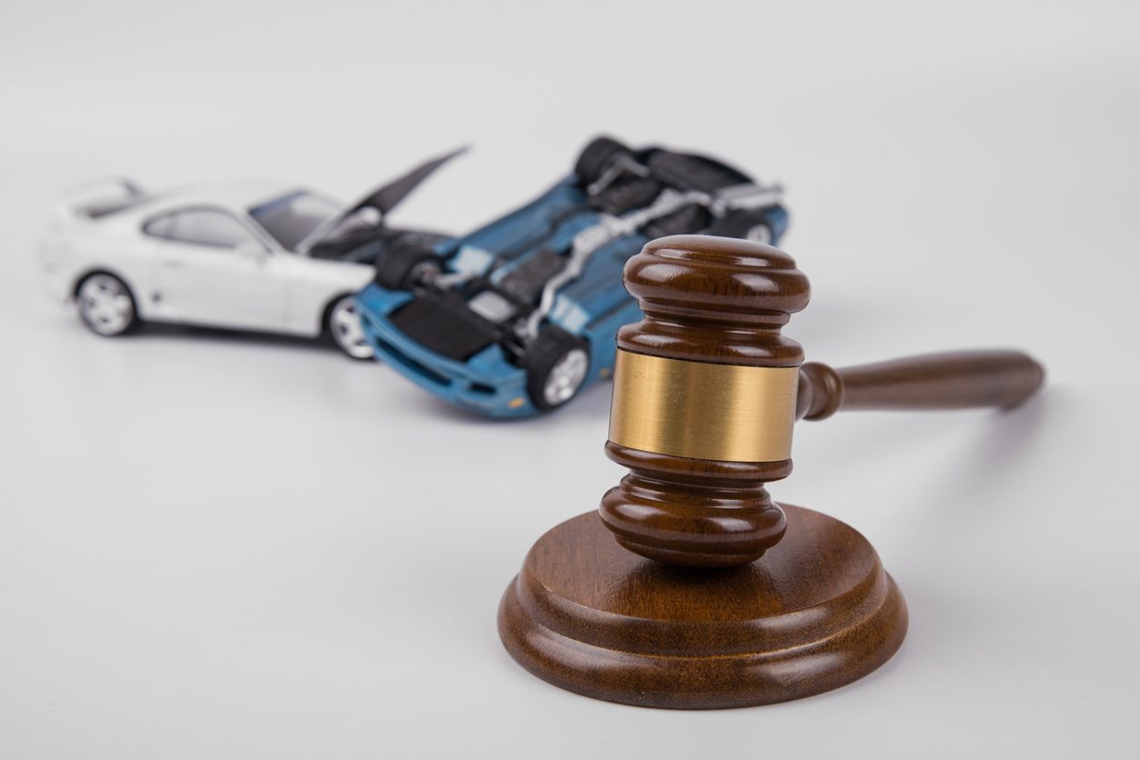 hammer of the judge. two collided cars on a white background. accident. Insurance, court case