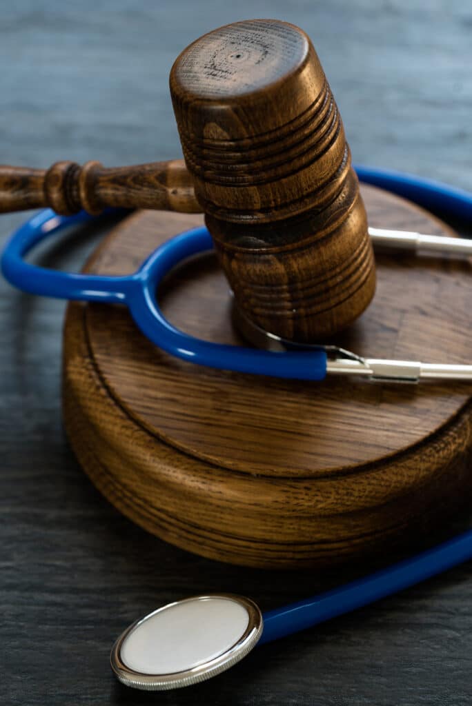Law and Justice concept. Gavel and stethoscope to represent personal injury lawyer